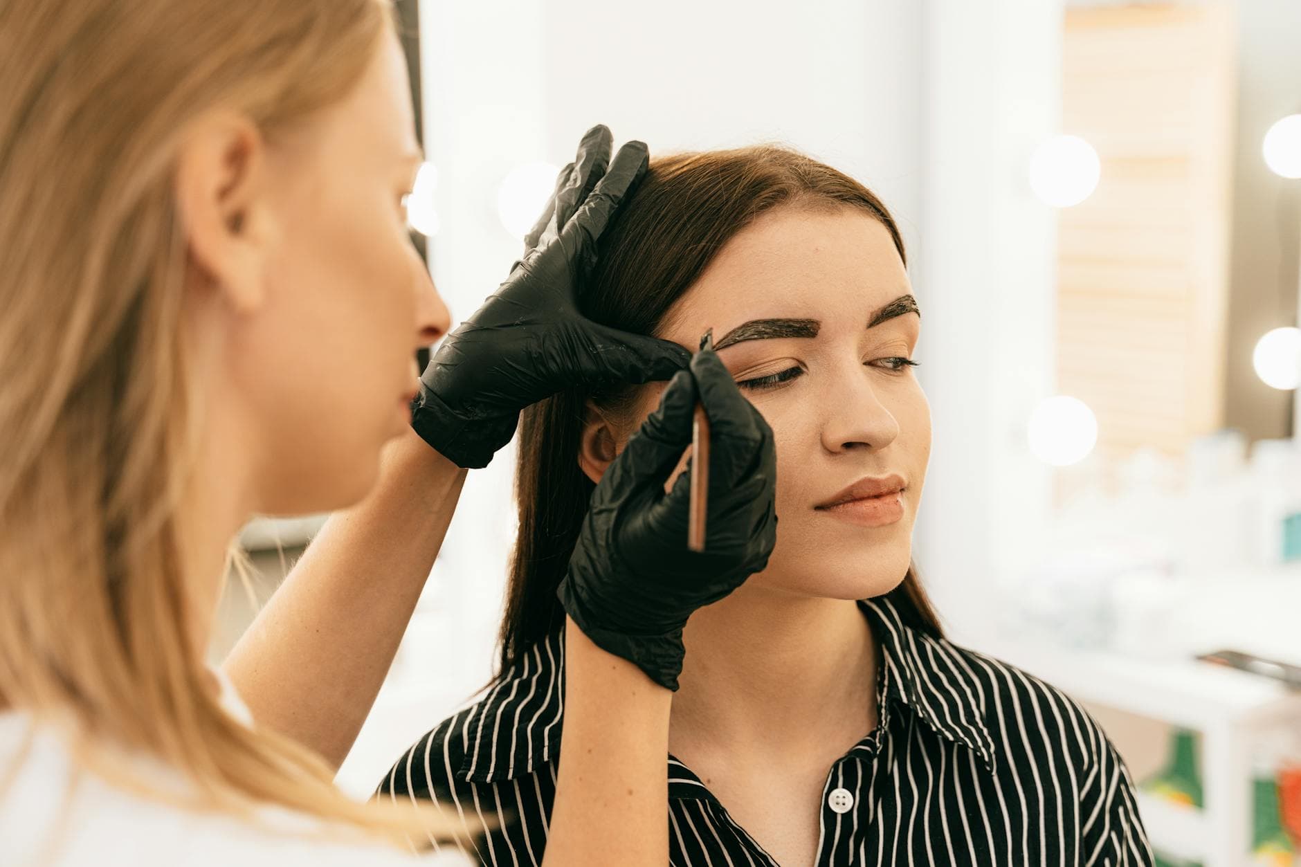 Eyebrow shaping treatment at a beauty bar